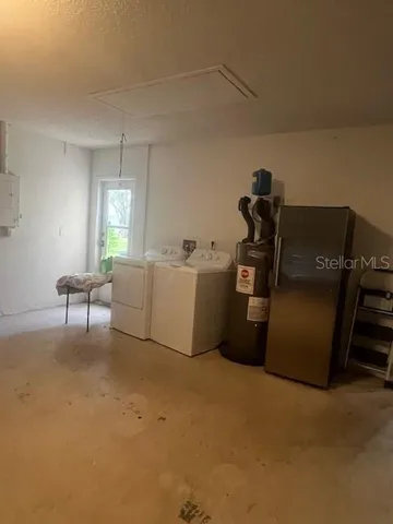 a living room with furniture and a air conditioner vent