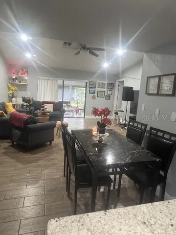 a kitchen with a dining table and chairs