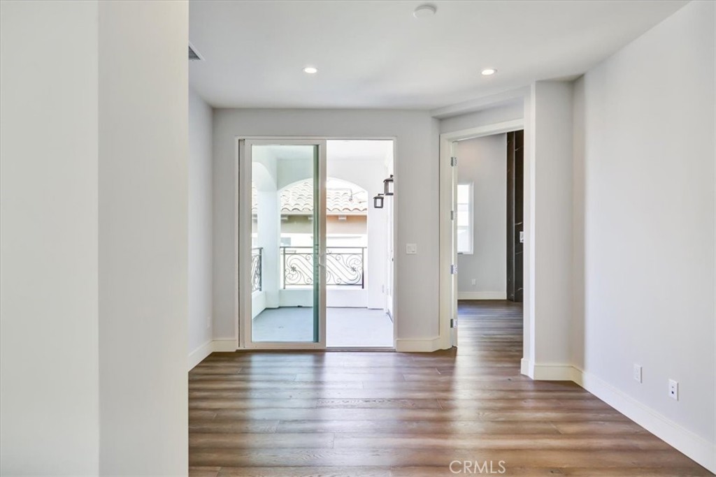 1908 Perry Avenue, Unit B Redondo Beach, CA 90278 - Photo 15 of 20 a view of an empty room with wooden floor and a window