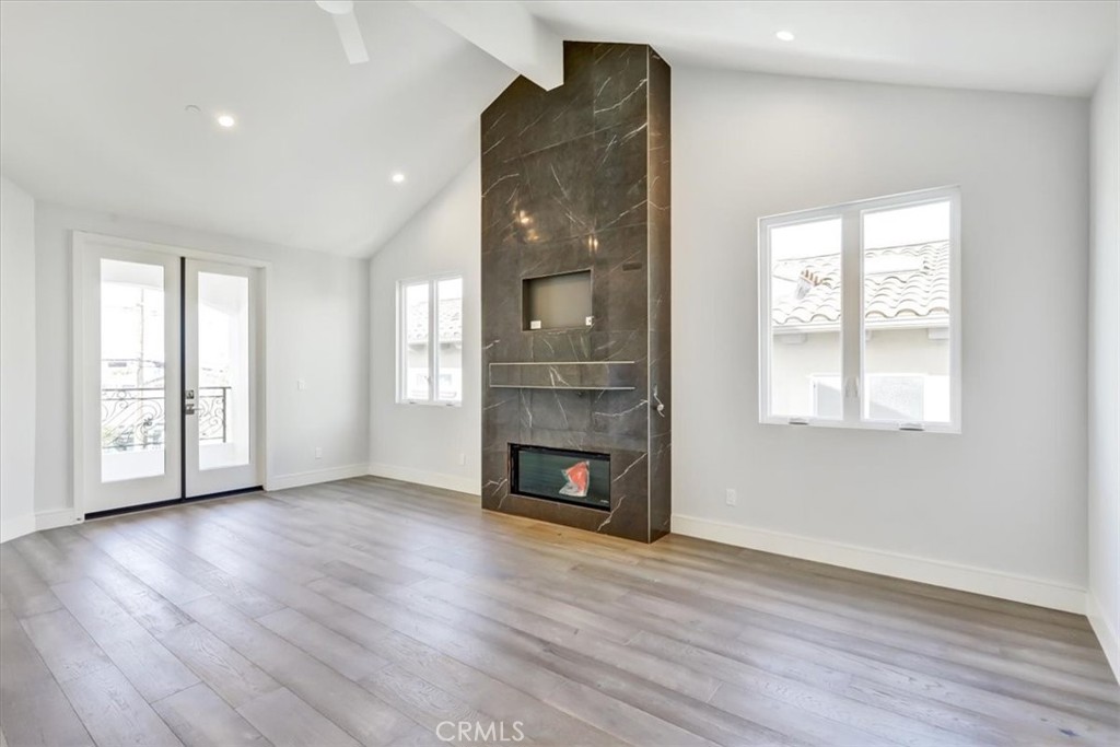 1908 Perry Avenue, Unit B Redondo Beach, CA 90278 - Photo 16 of 20 wooden floor fireplace and windows in an empty room