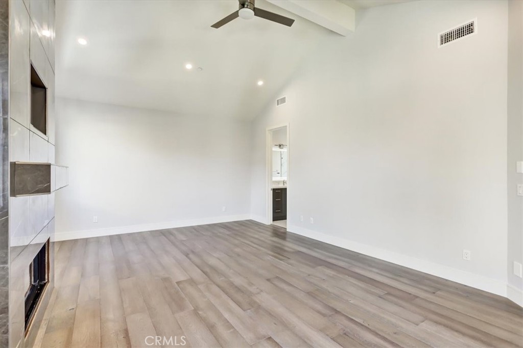 1908 Perry Avenue, Unit B Redondo Beach, CA 90278 - Photo 17 of 20 a view of an empty room with wooden floor and a window