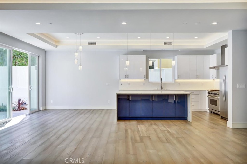 1908 Perry Avenue, Unit B Redondo Beach, CA 90278 - Photo 3 of 20 a large room with a large window and stainless steel appliances