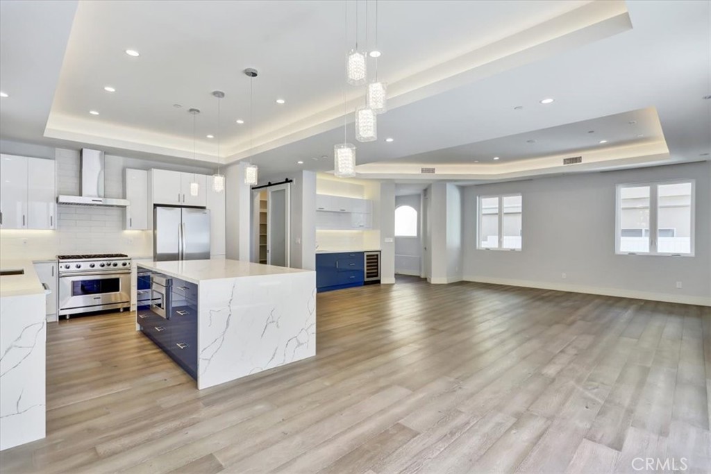 1908 Perry Avenue, Unit B Redondo Beach, CA 90278 - Photo 4 of 20 a large kitchen with stainless steel appliances granite countertop a large counter top and a stove