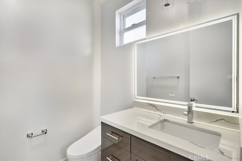 1908 Perry Avenue, Unit B Redondo Beach, CA 90278 - Photo 6 of 20 a bathroom with a sink and a mirror