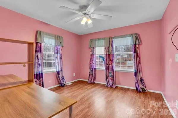 a view of livingroom with hardwood floor and ceiling fan
