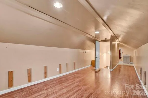 a view of a living room with wooden floor