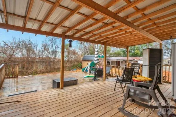 a view of a patio with wooden floor