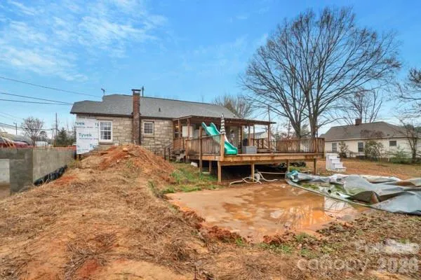 a view of a house with backyard porch and sitting area
