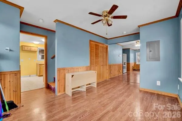 a view of an entryway with wooden floor