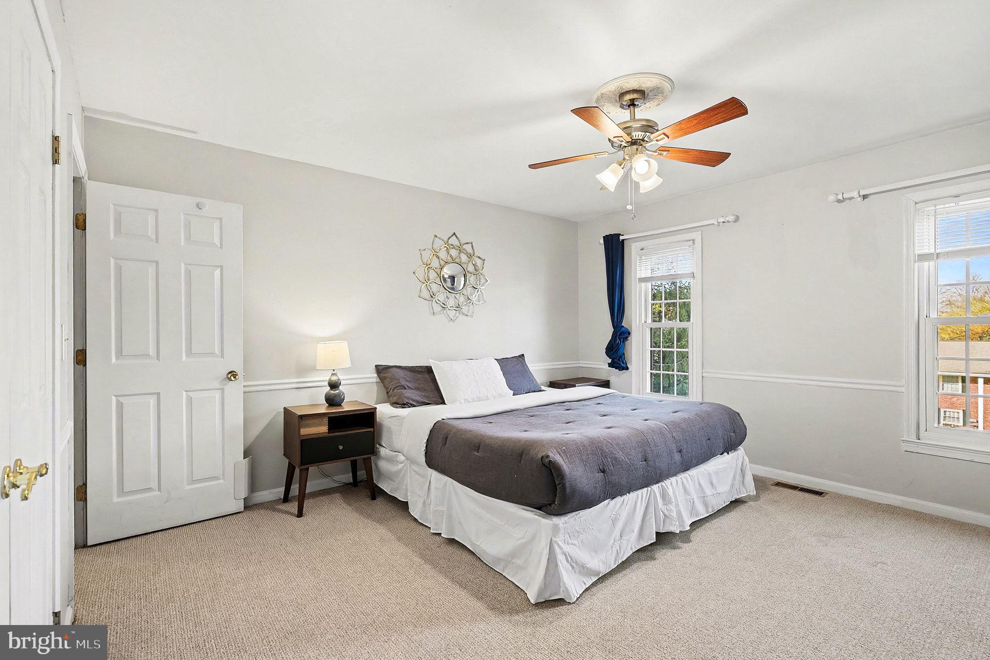 5822 Jackson Road Fredericksburg, VA 22407 - Photo 14 of 26 a spacious bedroom with a bed and a window