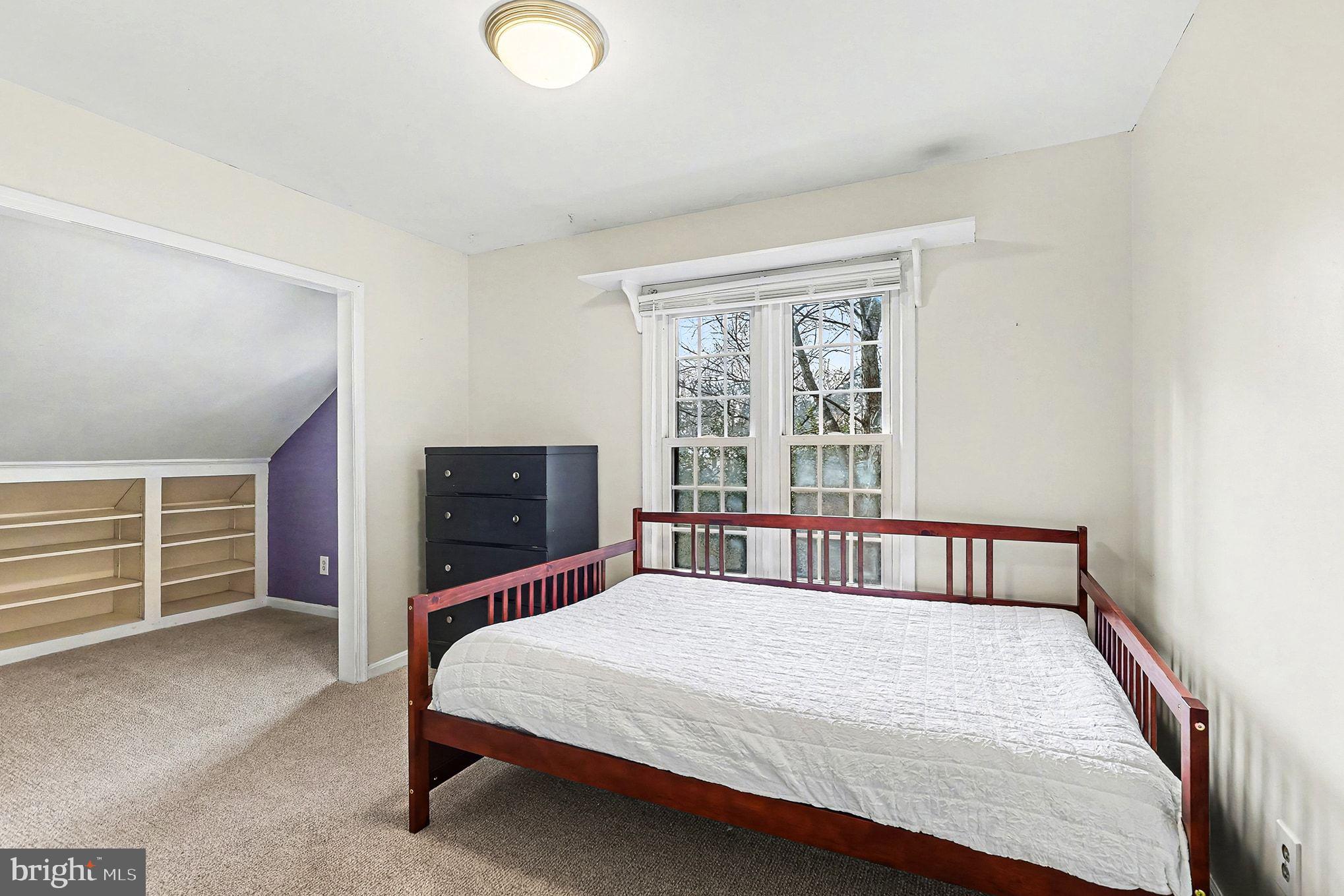 5822 Jackson Road Fredericksburg, VA 22407 - Photo 19 of 26 a bedroom with a large bed and a window