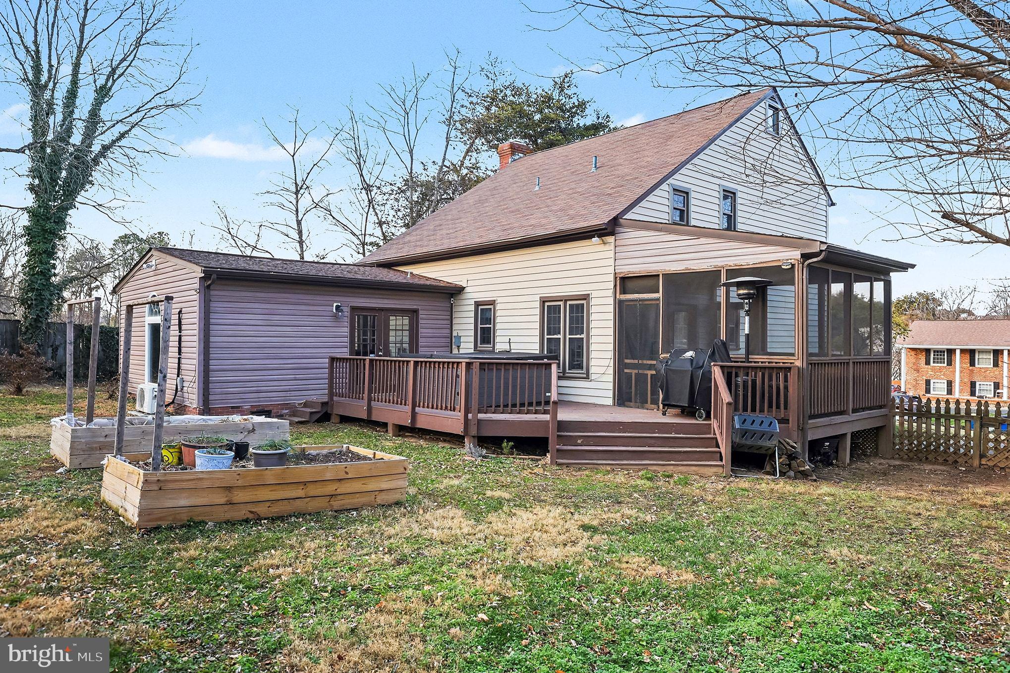 5822 Jackson Road Fredericksburg, VA 22407 - Photo 23 of 26 a front view of a house with a yard glass top table and chairs