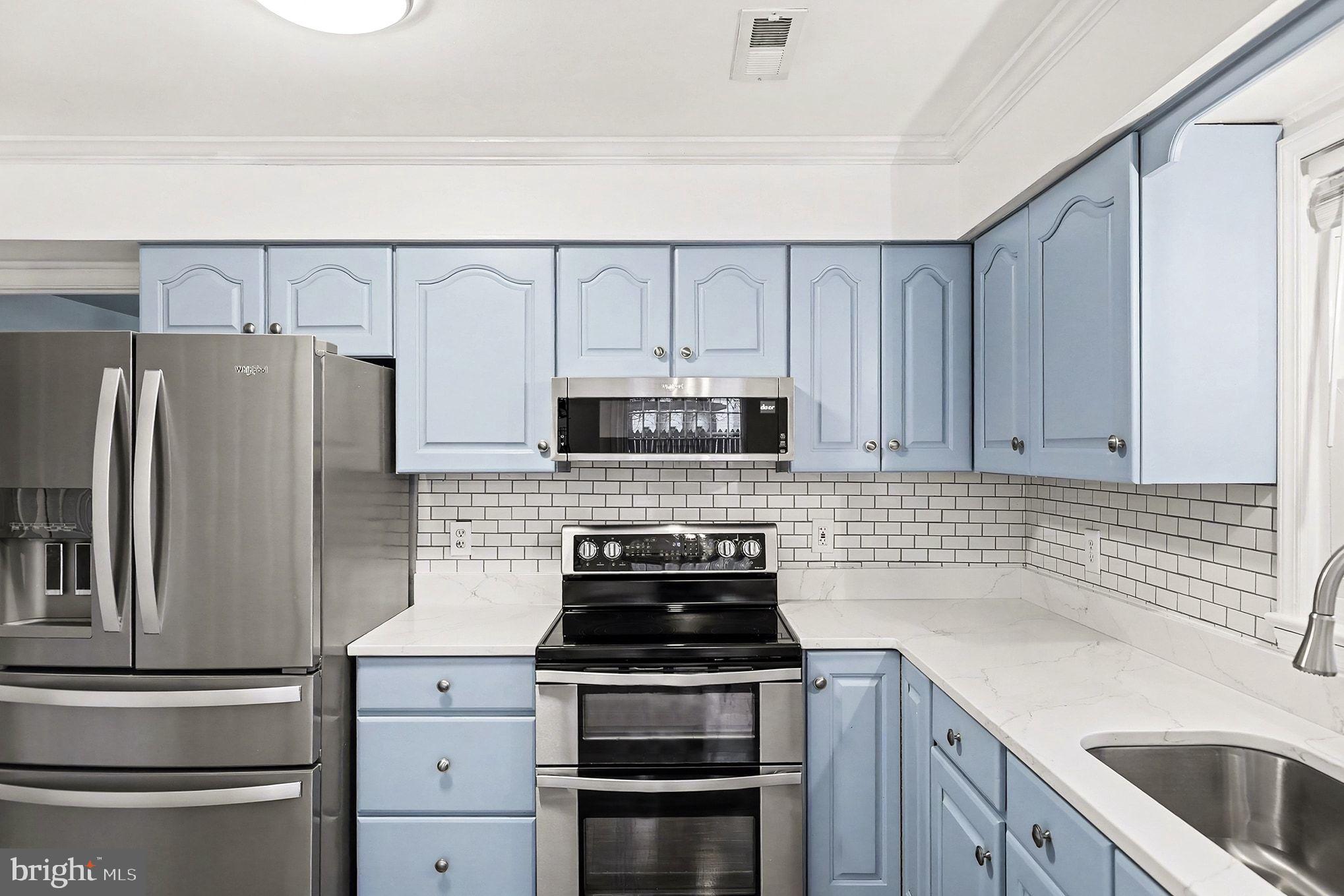 5822 Jackson Road Fredericksburg, VA 22407 - Photo 6 of 26 a kitchen with appliances a sink and cabinets