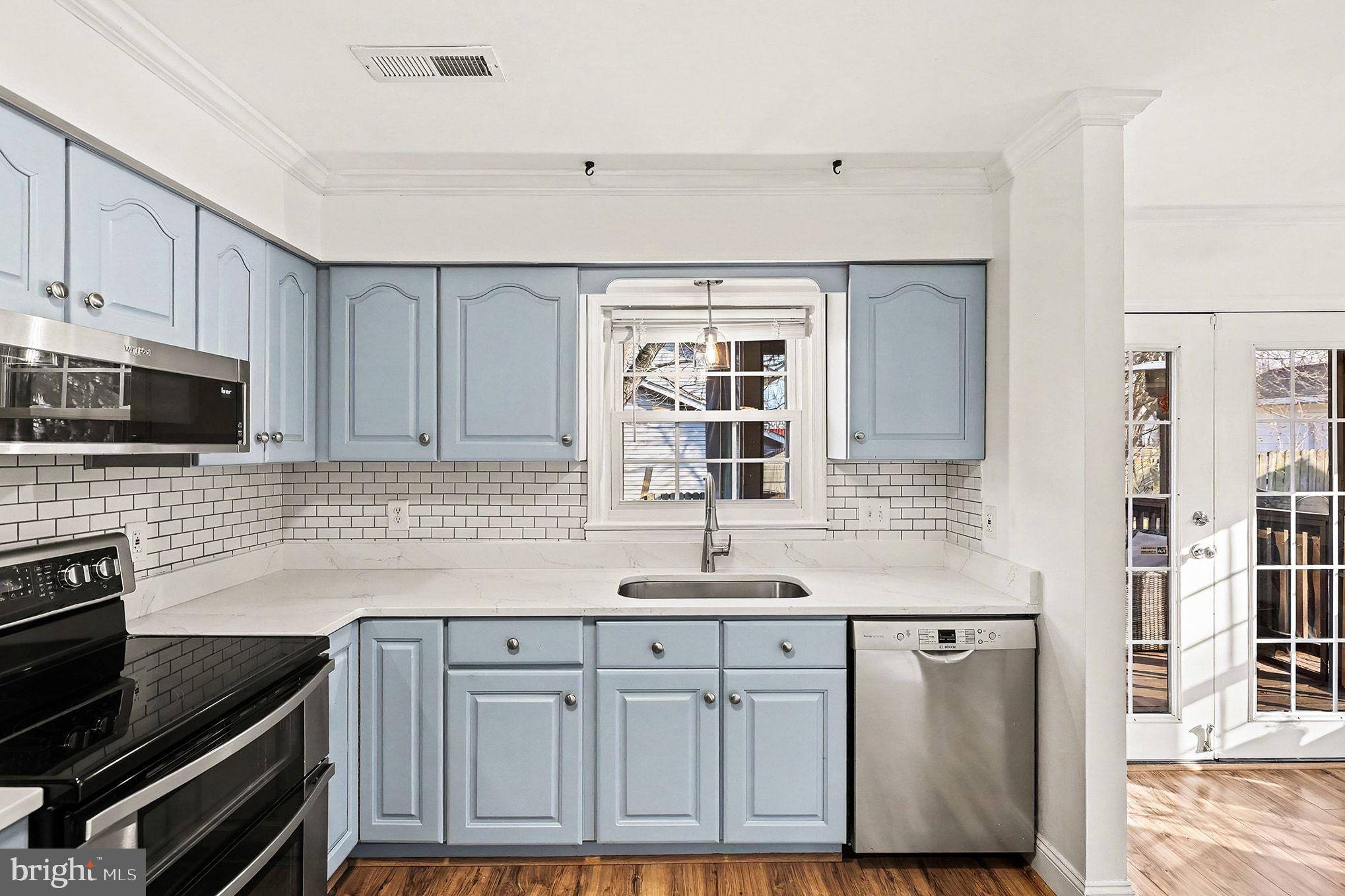5822 Jackson Road Fredericksburg, VA 22407 - Photo 7 of 26 a kitchen with granite countertop a stove and a sink