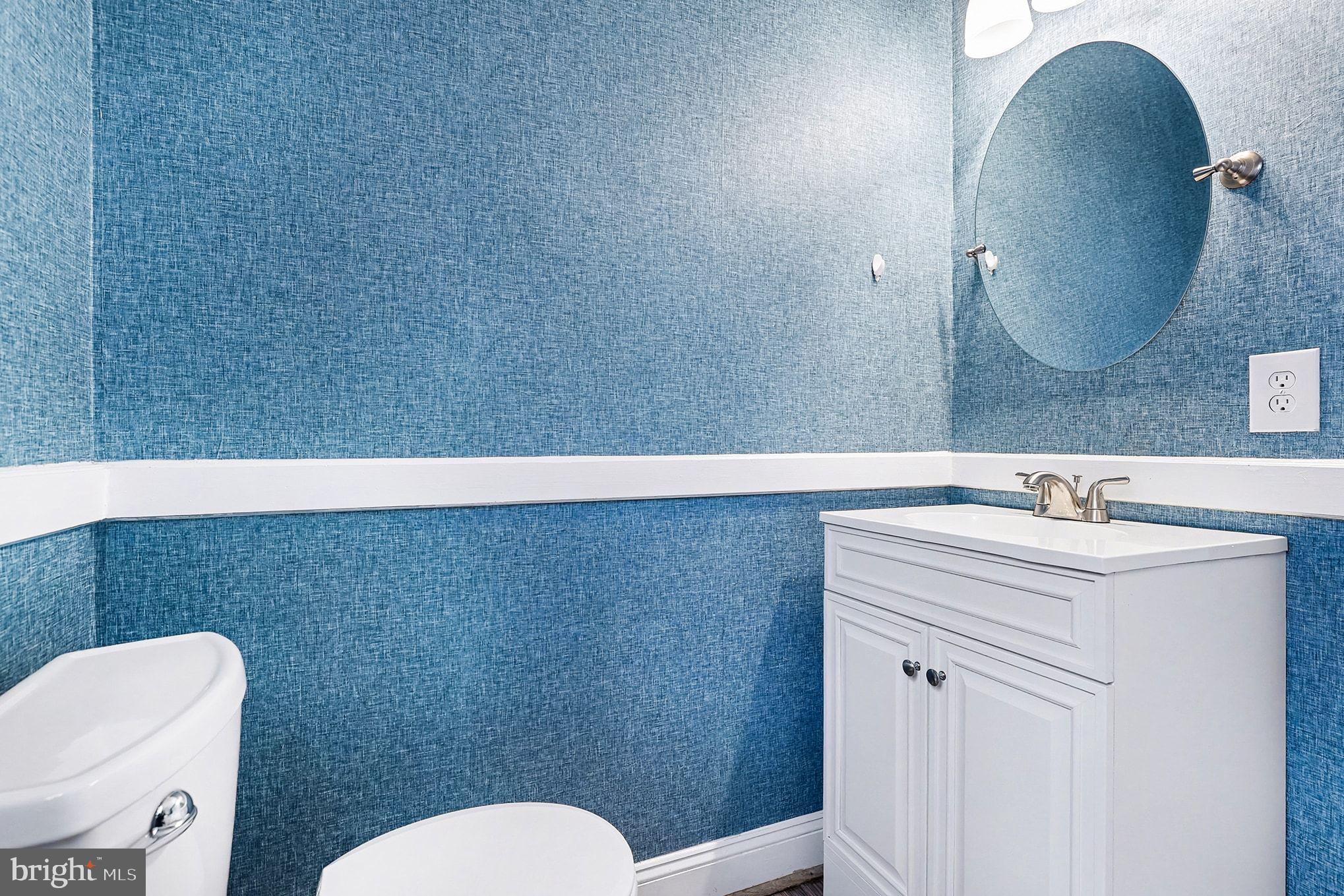 5822 Jackson Road Fredericksburg, VA 22407 - Photo 10 of 26 a bathroom with a toilet a sink and mirror