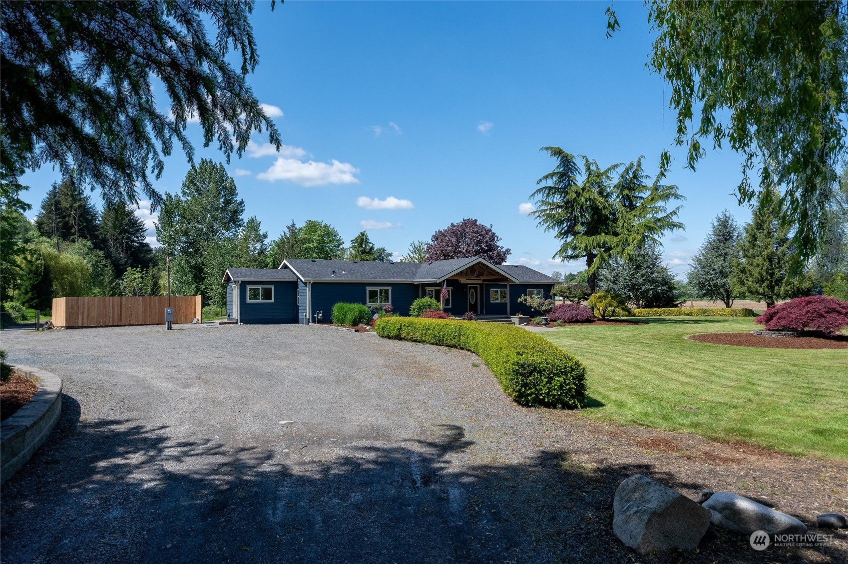 5805 Lawrence Road Everson, WA 98247 - Photo 14 of 35 a front view of a house with a yard and garage