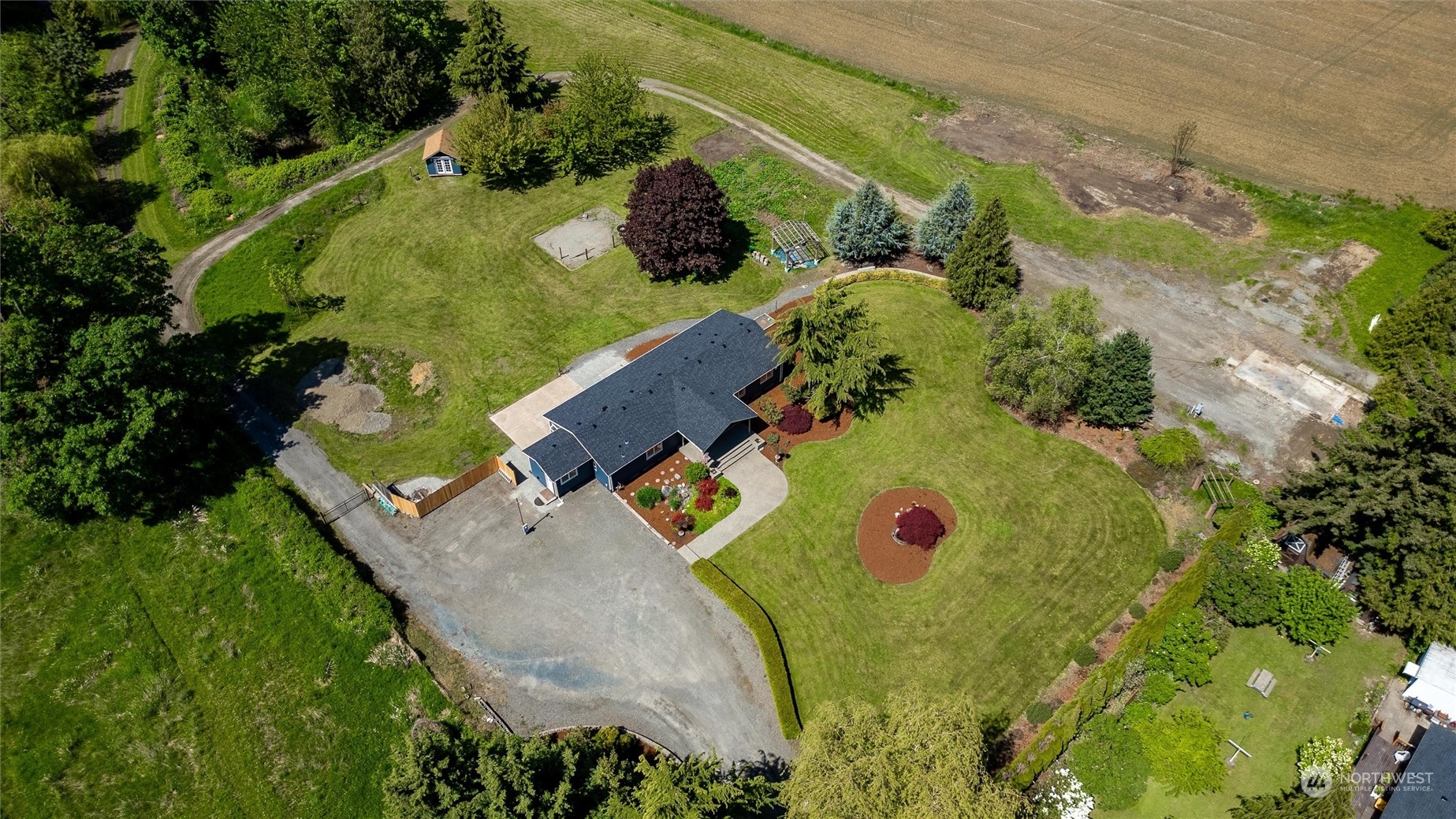 5805 Lawrence Road Everson, WA 98247 - Photo 18 of 35 an aerial view of a house with a swimming pool