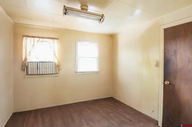 a kitchen with stainless steel appliances granite countertop wooden cabinets a sink and a window