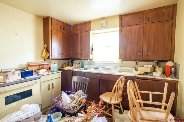 a view of kitchen filled with appliances and cabinets