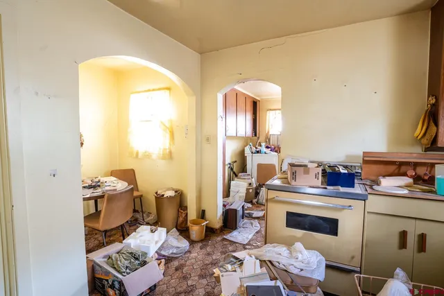 a view of a bedroom with a table and chairs