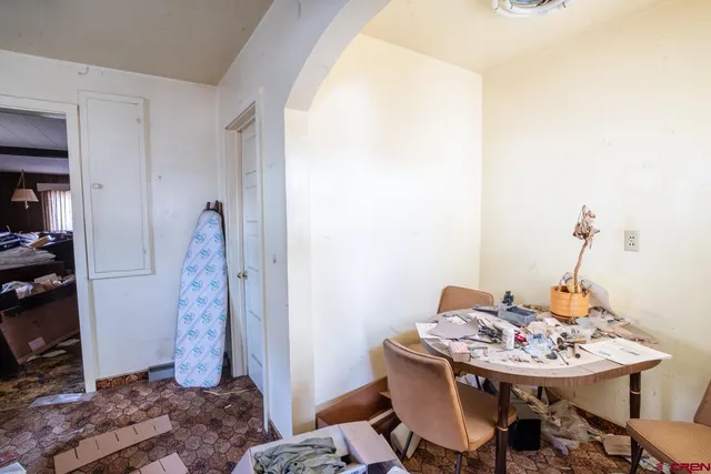 a view of a livingroom with furniture and a window