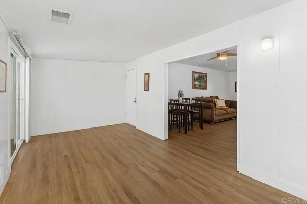 a view of a livingroom with furniture and wooden floor