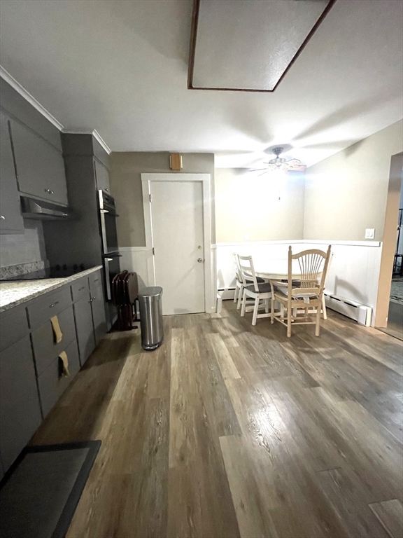 41 Hardwick Street, Unit 1 Boston, MA 02135 - Photo 4 of 11 a living room with furniture and a wooden floor