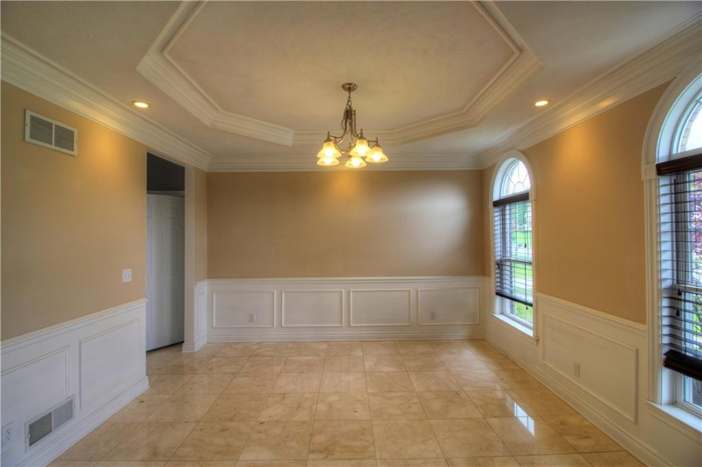 129 Chestnut Ridge Drive Beaver Falls, PA 15010 - Photo 12 of 25 Formal Dinaing Room. Boasting custom ceiling and wainscoting, paladium style windows and neutral tones completement the quality, custom marble floors. Designed to last!