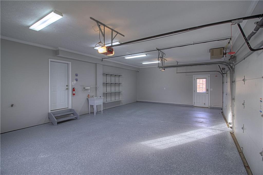 129 Chestnut Ridge Drive Beaver Falls, PA 15010 - Photo 24 of 25 Professionally finished garage w/epoxy type floor. Great additional space with access to back yard via the man door!