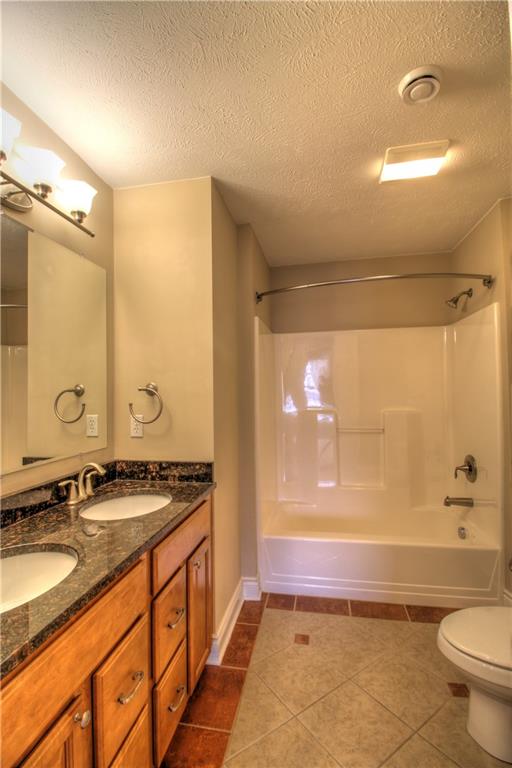 129 Chestnut Ridge Drive Beaver Falls, PA 15010 - Photo 7 of 25 Guest Bath featuring dual sinks, ceramic tile floors and warm tones!