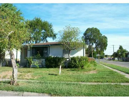 a view of a house with yard and a garden
