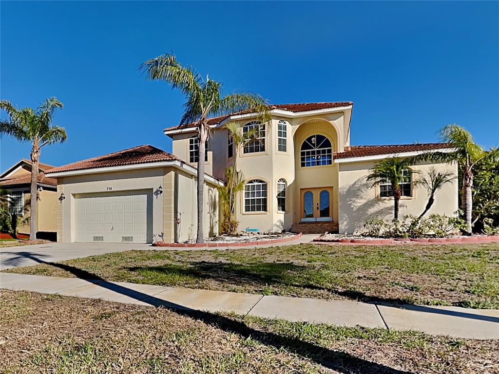 a front view of a house with a yard