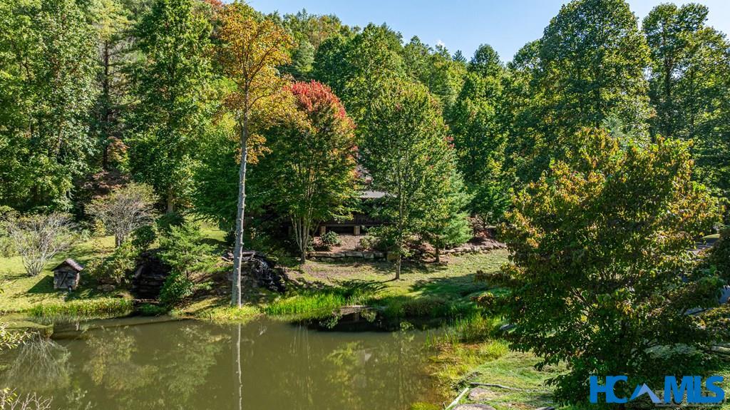 1857 Pilot Knob Road Tuckasegee, NC 28783 - Photo 3 of 44 Sounds of the pond waterfall easily heard.