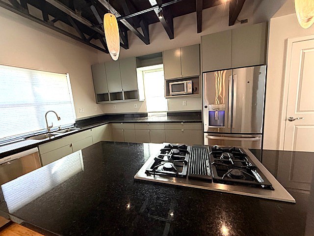 4243 Purdue Street, Unit C Houston, TX 77005 - Photo 15 of 48 a kitchen with kitchen island a stove and a sink