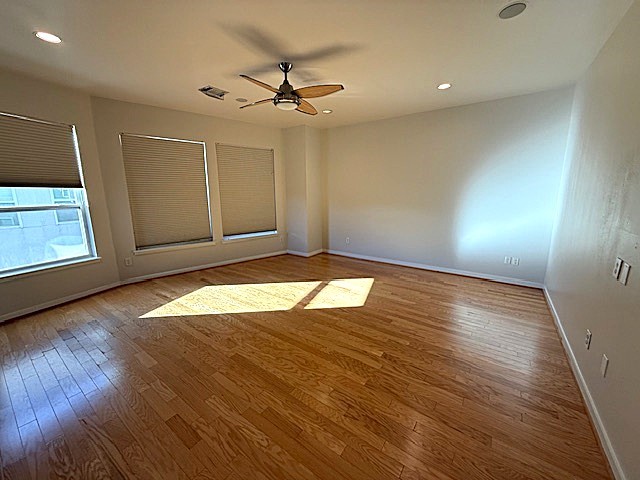 4243 Purdue Street, Unit C Houston, TX 77005 - Photo 24 of 48 a view of empty room with wooden floor and fan