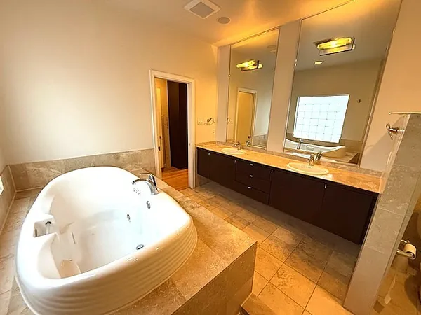 a bathroom with a bathtub and a sink