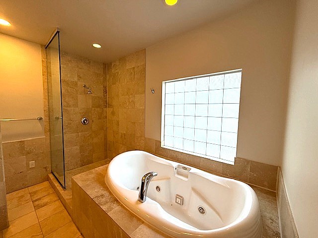 4243 Purdue Street, Unit C Houston, TX 77005 - Photo 26 of 48 a bathroom with a bathtub and shower