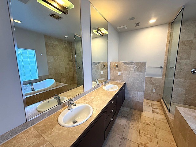4243 Purdue Street, Unit C Houston, TX 77005 - Photo 27 of 48 a bathroom with a granite countertop sink mirror vanity and toilet