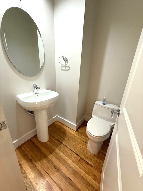 4243 Purdue Street, Unit C Houston, TX 77005 - Photo 28 of 48 a bathroom with a sink toilet and a mirror