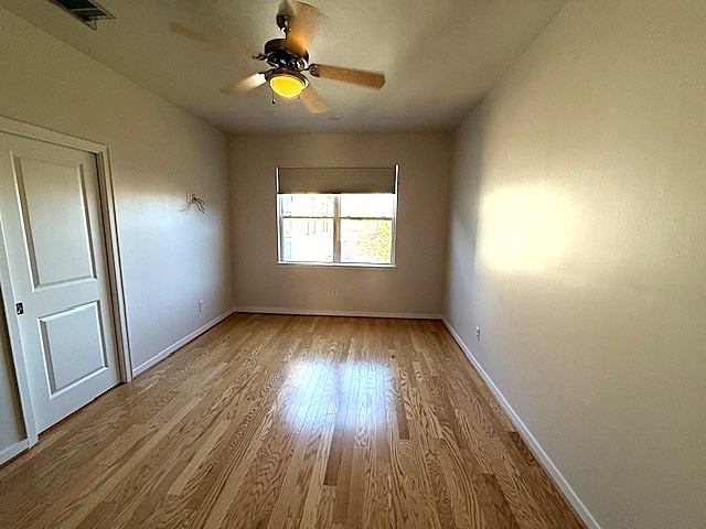 4243 Purdue Street, Unit C Houston, TX 77005 - Photo 34 of 48 a view of empty room with wooden floor and fan