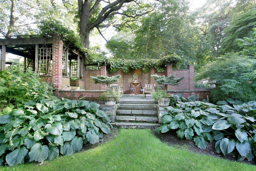 20 Malia Terrace Newton, MA 02467 - Photo 18 of 21 a front view of a house with a yard and green space