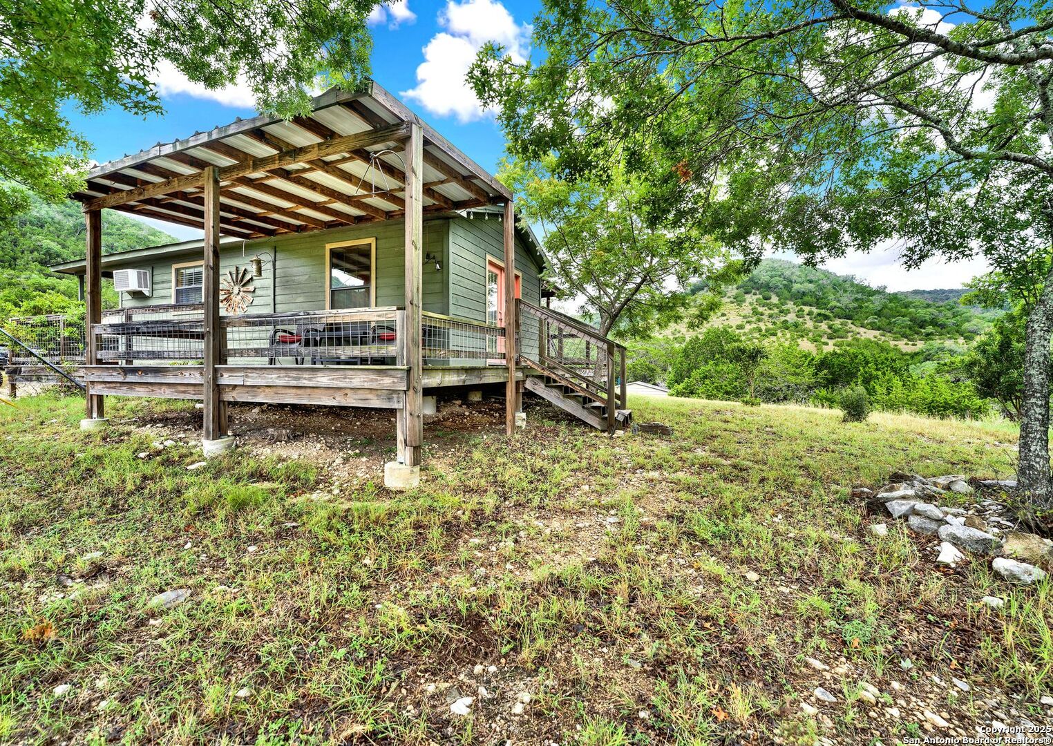 3695 Rio Hondo Road Tarpley, TX 78883 - Photo 12 of 47 a view of house with a yard