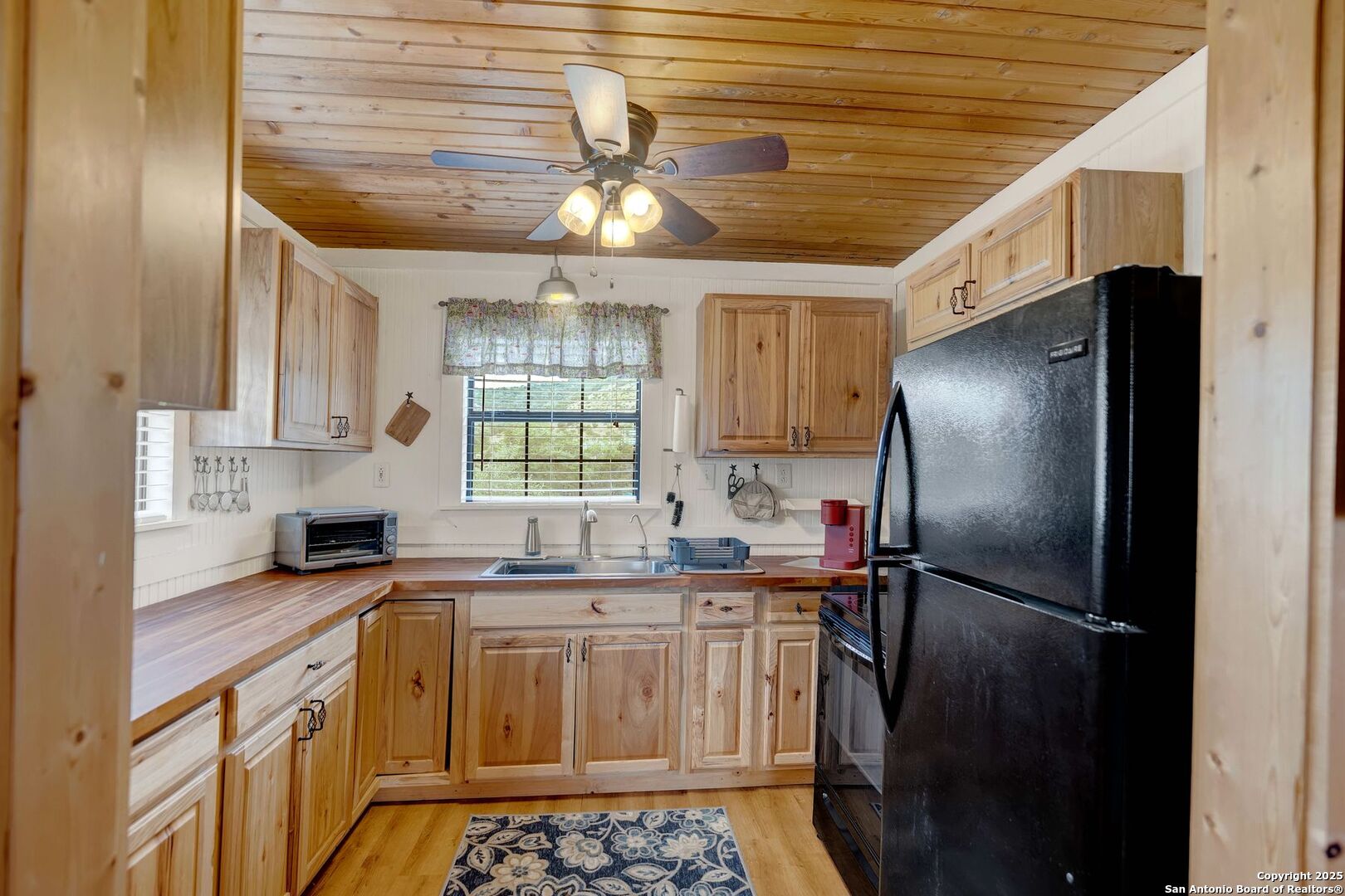 3695 Rio Hondo Road Tarpley, TX 78883 - Photo 15 of 47 a kitchen with stainless steel appliances a refrigerator and a sink