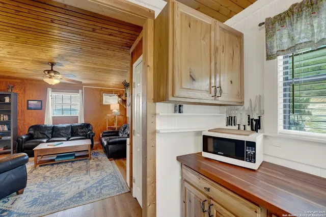 a view of a livingroom with furniture and a fireplace