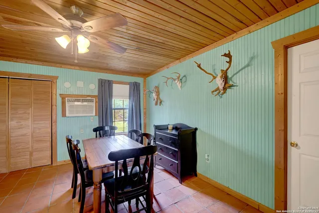a view of a dining room with furniture and window