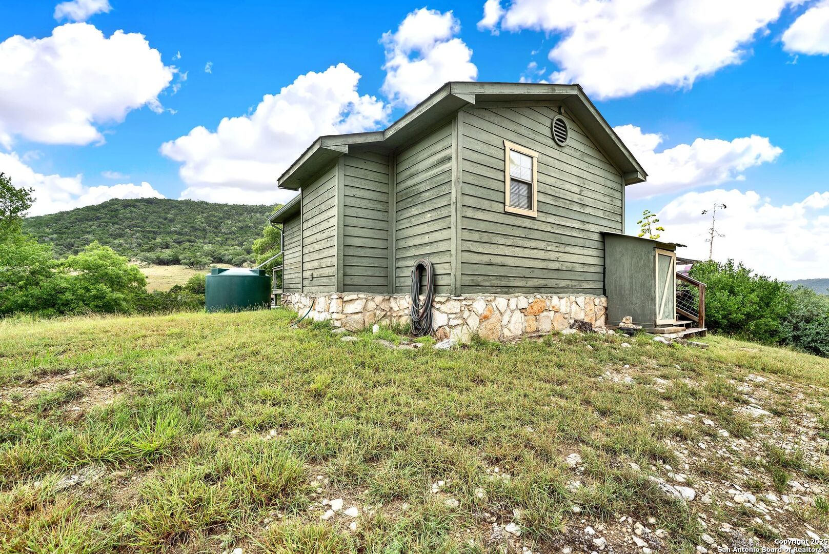 3695 Rio Hondo Road Tarpley, TX 78883 - Photo 29 of 47 a front view of a house with a yard