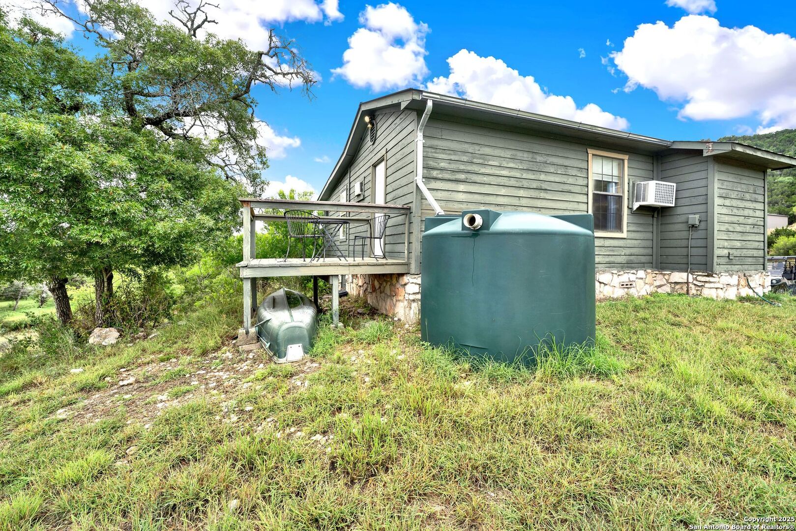 3695 Rio Hondo Road Tarpley, TX 78883 - Photo 30 of 47 a view of a house with a yard