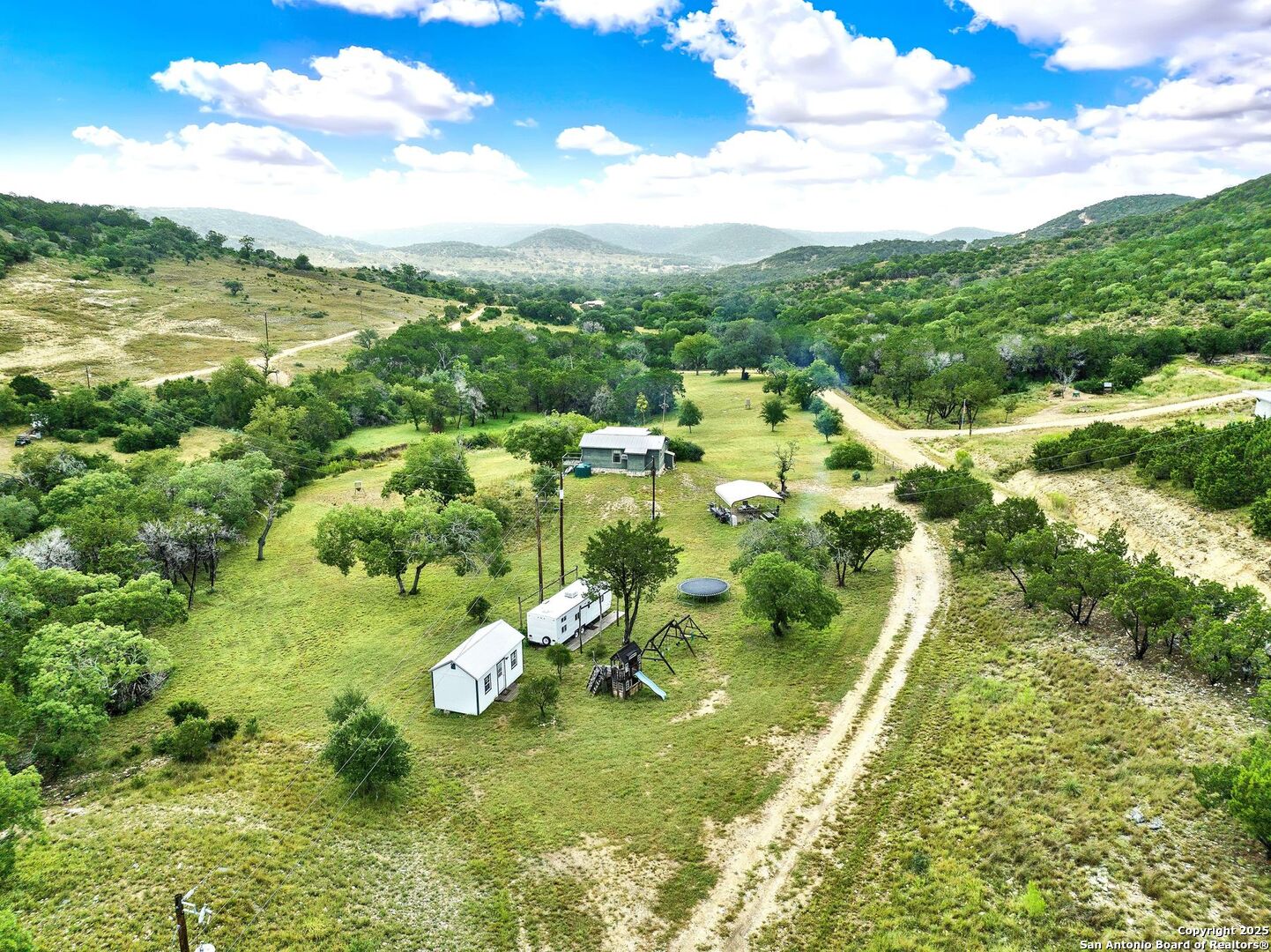 3695 Rio Hondo Road Tarpley, TX 78883 - Photo 3 of 47 a view of a lake with a houses