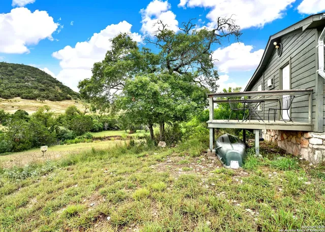 a backyard of a house with lots of green space