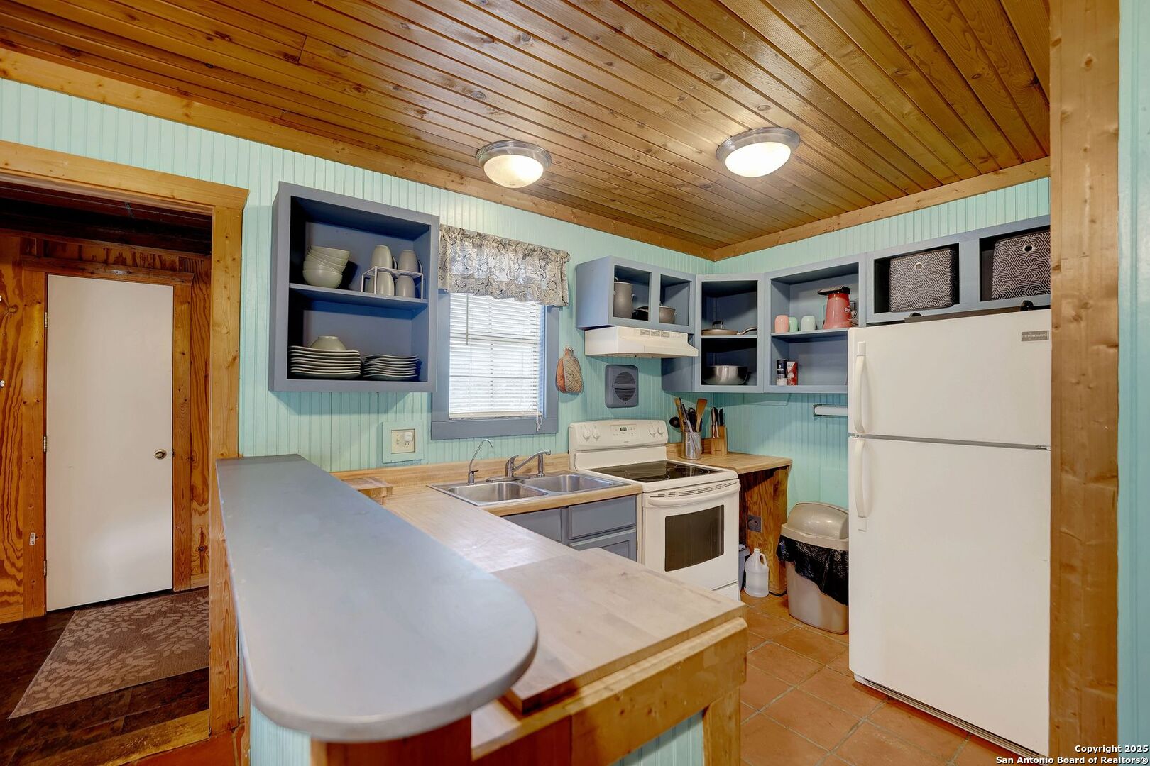 3695 Rio Hondo Road Tarpley, TX 78883 - Photo 33 of 47 a room with furniture a flat screen tv and a refrigerator